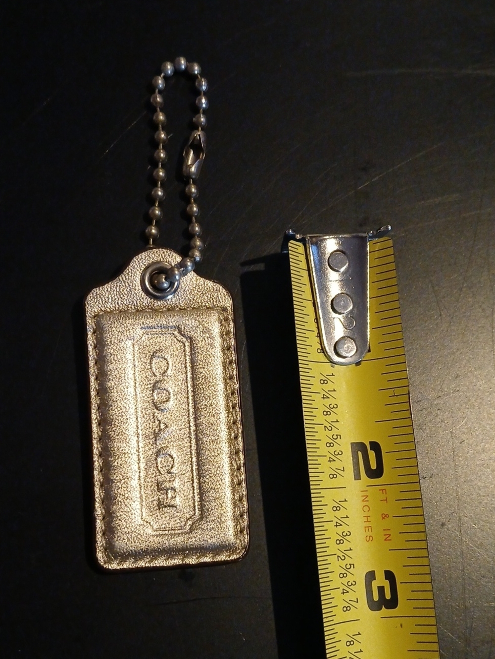 Silver Leather Coach Hangtag Small Flaw On Back